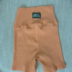 Daily Drills orange stretchy shorts